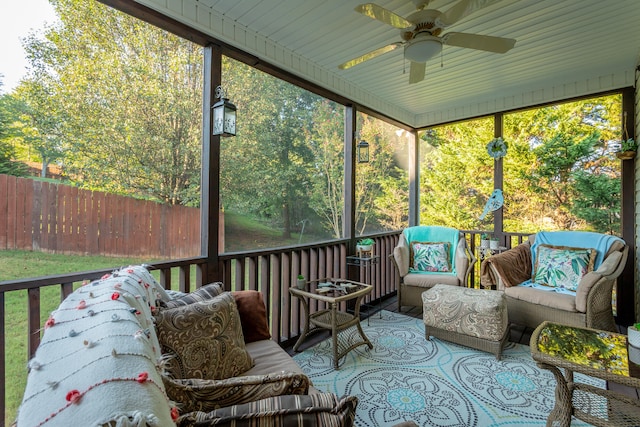 sunroom / solarium with wood ceiling and ceiling fan