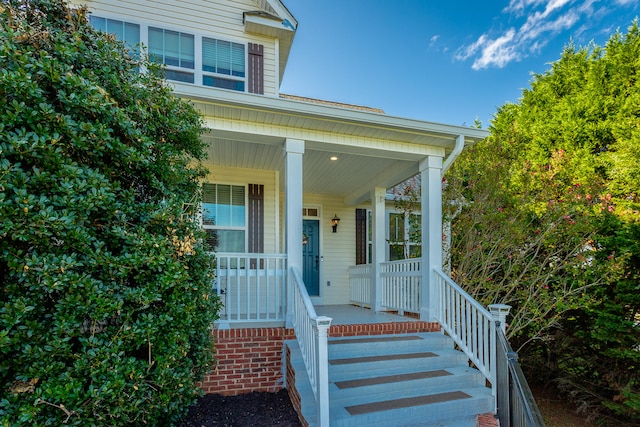 entrance to property with a porch