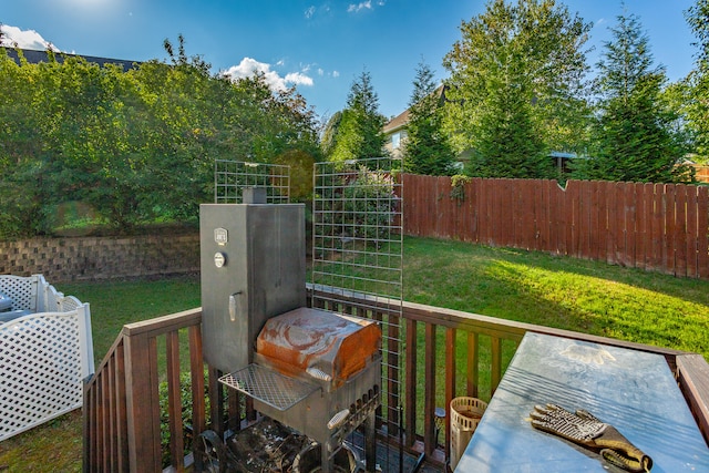 wooden deck with a lawn