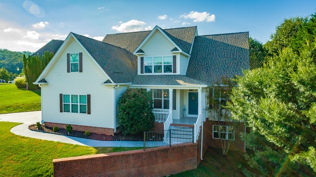 exterior space with a front yard and a porch