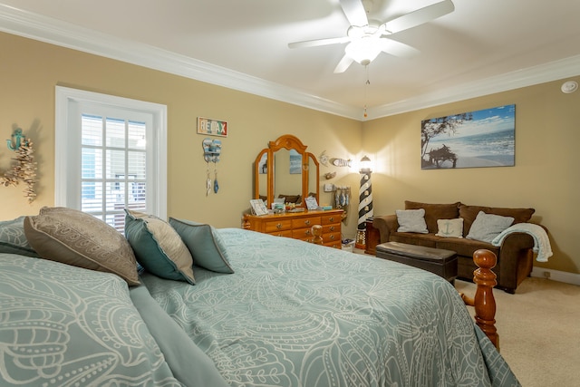 carpeted bedroom featuring ceiling fan and ornamental molding