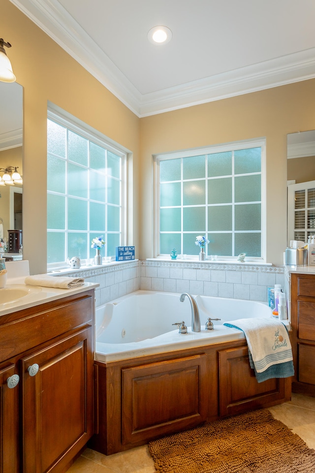 bathroom with ornamental molding, vanity, tile patterned floors, and a bathtub