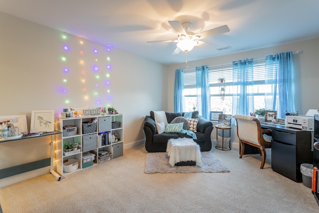 carpeted home office with ceiling fan