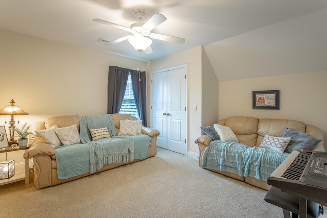 living room with light colored carpet, ceiling fan, and vaulted ceiling