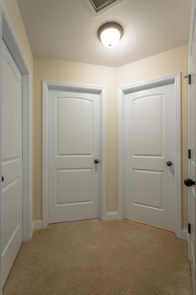 corridor with light carpet