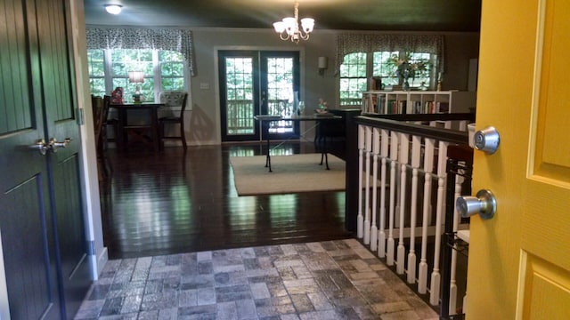 entryway with a notable chandelier