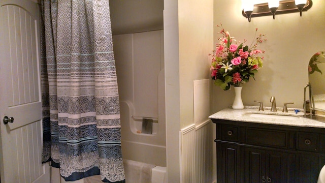 bathroom featuring vanity and shower / tub combo