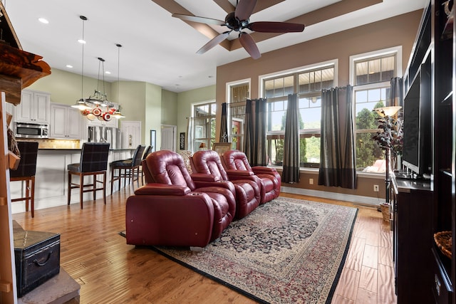 living room with ceiling fan and light wood-type flooring