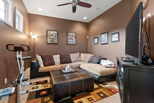 living room featuring ceiling fan and light colored carpet