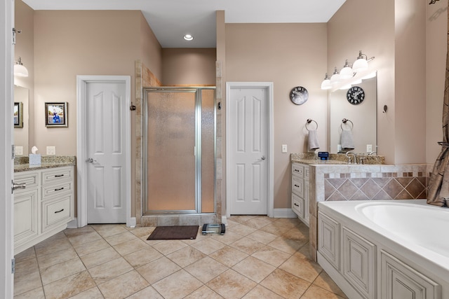 bathroom featuring shower with separate bathtub, tile patterned flooring, and vanity