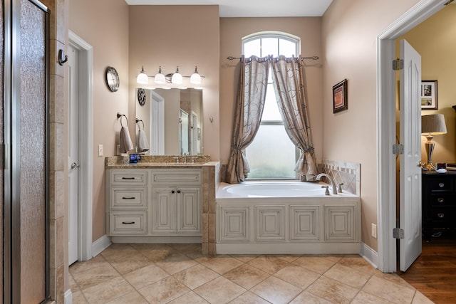 bathroom featuring vanity and shower with separate bathtub