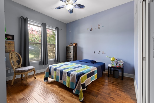 bedroom with wood-type flooring and ceiling fan