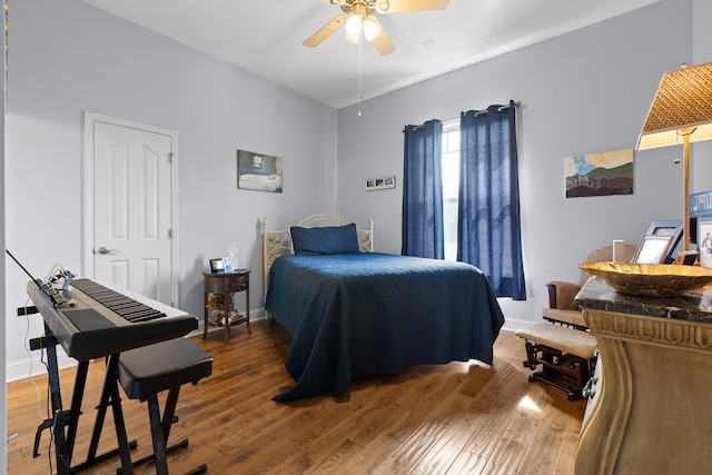 bedroom featuring ceiling fan and dark hardwood / wood-style flooring