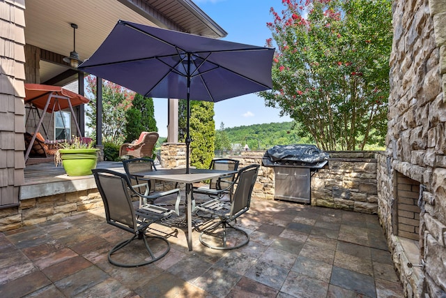 view of patio featuring a grill