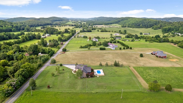 birds eye view of property featuring a mountain view and a rural view