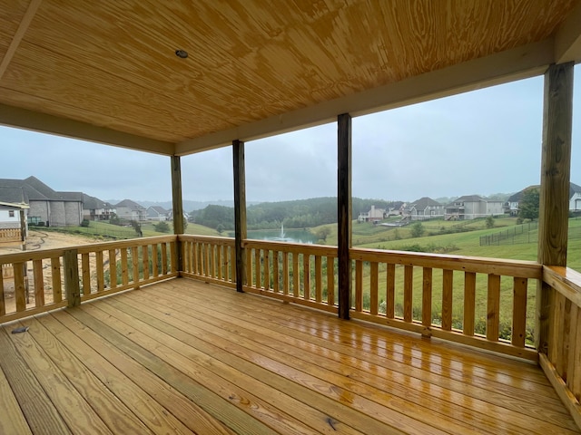 wooden deck with a water view