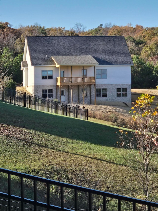 back of property featuring a yard