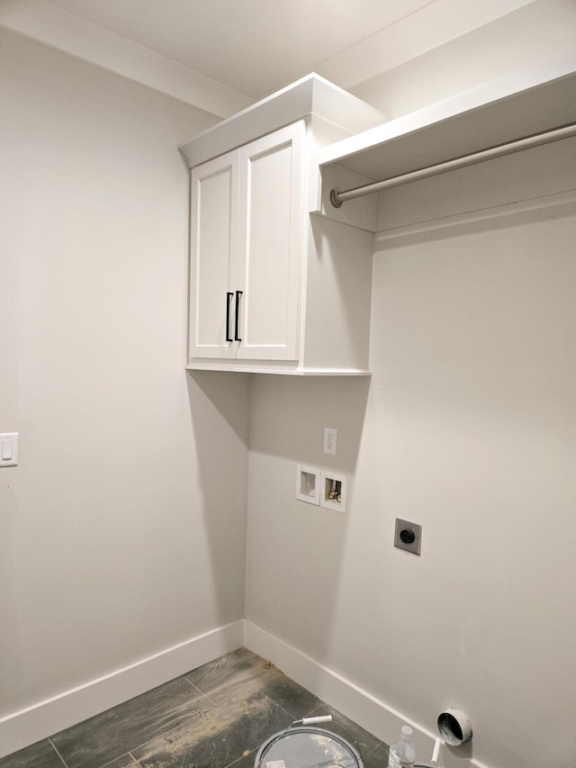 clothes washing area with cabinets, washer hookup, and hookup for an electric dryer