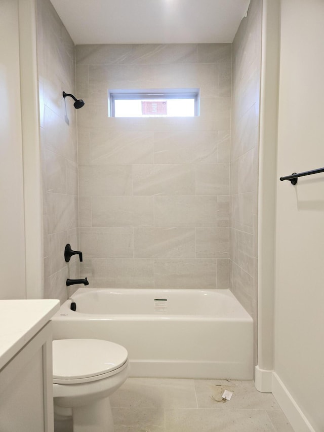 full bathroom with vanity, toilet, tile patterned floors, and tiled shower / bath combo