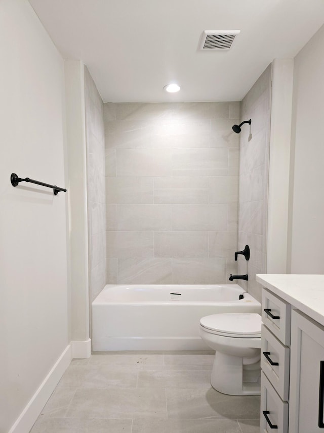 full bathroom featuring vanity, toilet, and tiled shower / bath