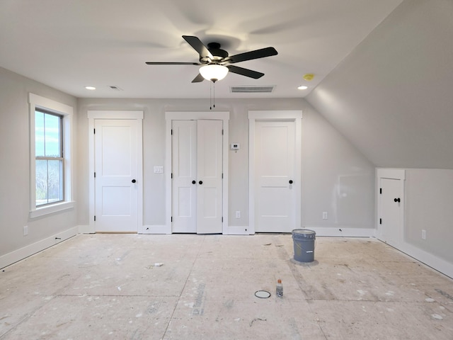 additional living space featuring vaulted ceiling and ceiling fan