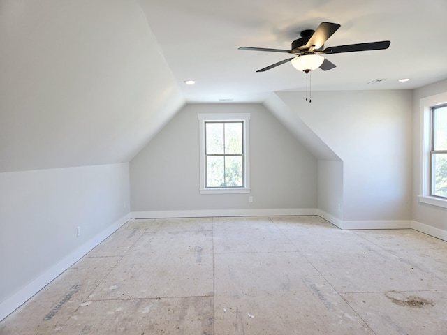 bonus room with vaulted ceiling and a healthy amount of sunlight