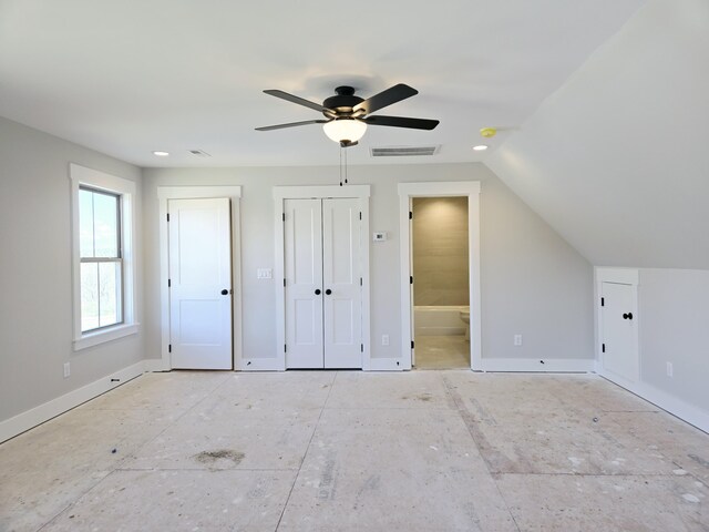 interior space featuring vaulted ceiling and ceiling fan