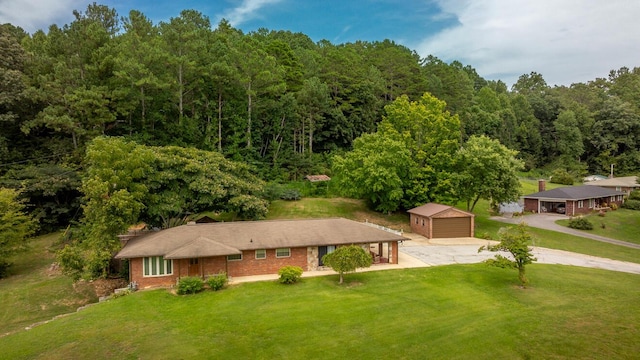 birds eye view of property with a view of trees