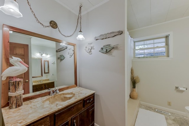 full bathroom with visible vents, baseboards, ornamental molding, and vanity