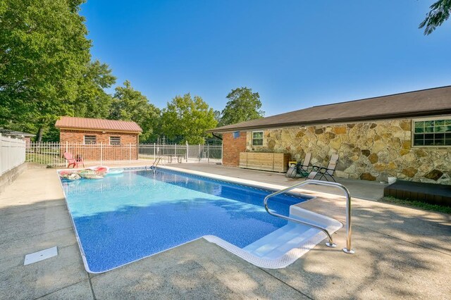 view of pool featuring a patio