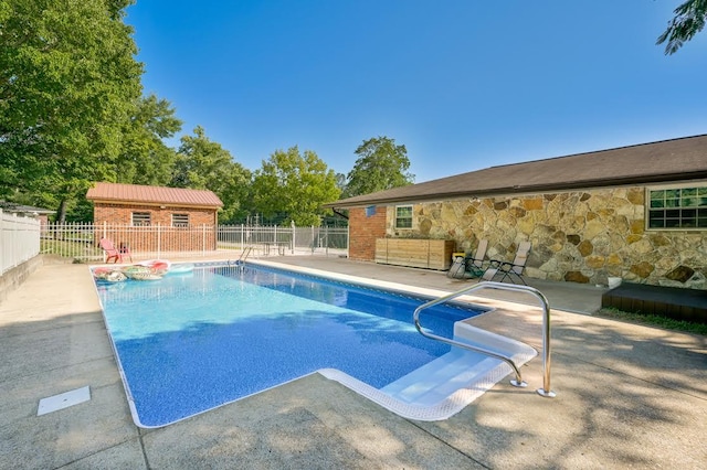 view of pool with a fenced in pool, a patio, and fence