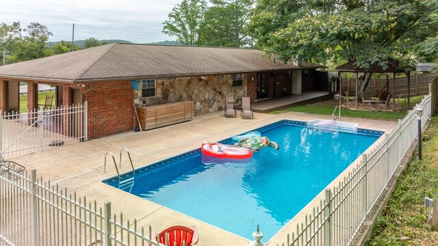 view of pool with a gazebo and a patio