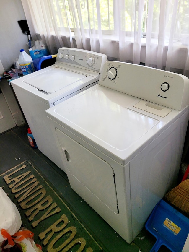 laundry area with independent washer and dryer