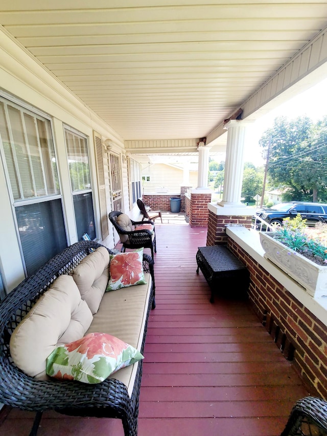 wooden deck with outdoor lounge area