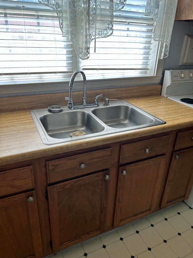 kitchen featuring sink and range