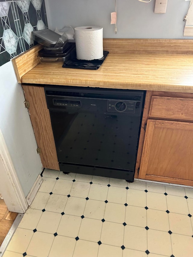 room details featuring dishwasher and tasteful backsplash