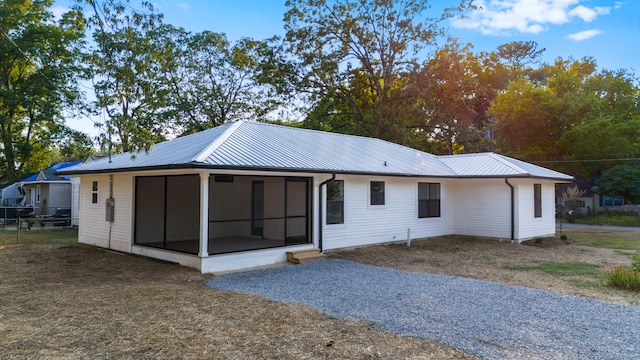 view of front of house with a sunroom