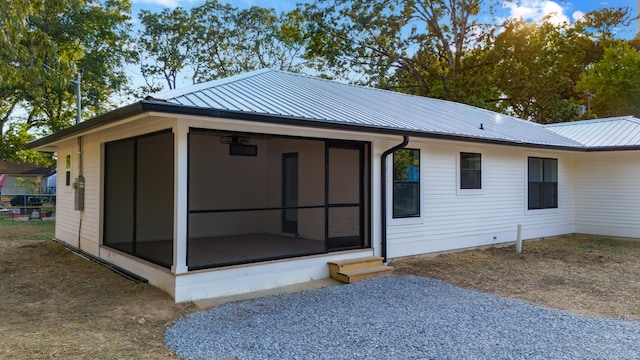 rear view of house with a sunroom