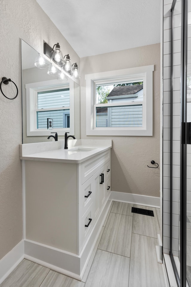 bathroom with hardwood / wood-style floors and vanity