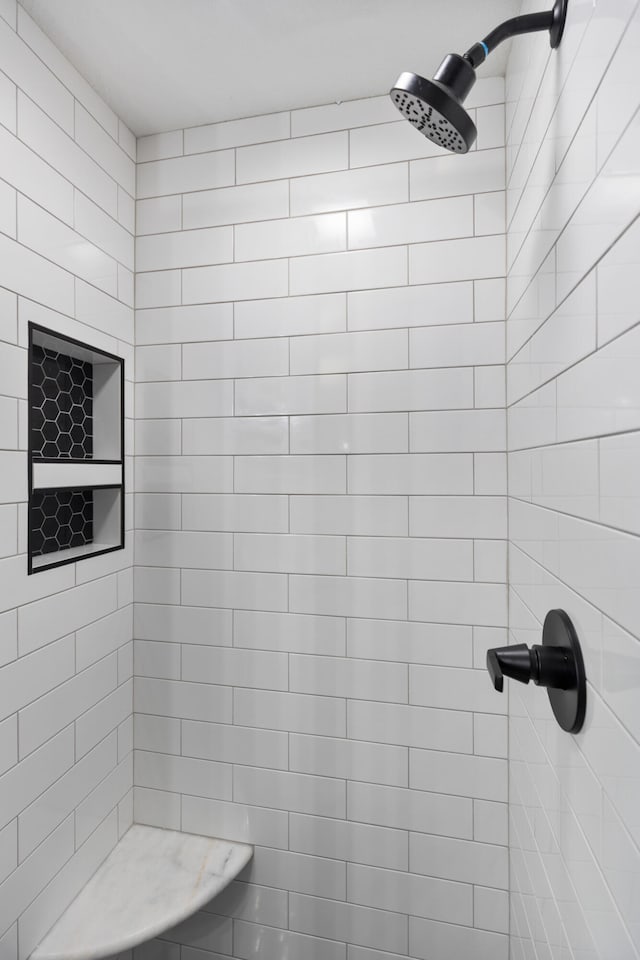 bathroom with tiled shower