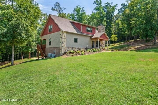 view of front of property with stone siding and a front lawn