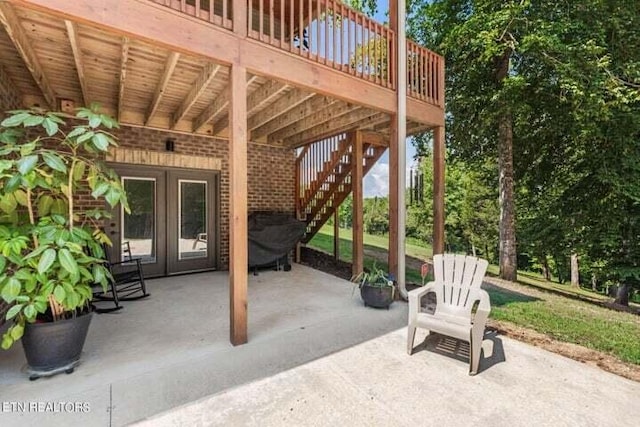 view of patio with french doors and stairs