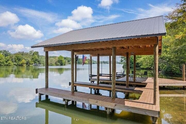 view of dock featuring boat lift and a water view