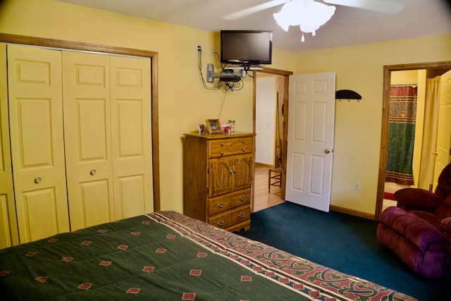 bedroom with a closet, ceiling fan, and dark colored carpet