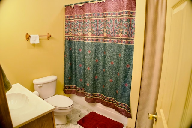 bathroom featuring vanity, toilet, and tile patterned floors