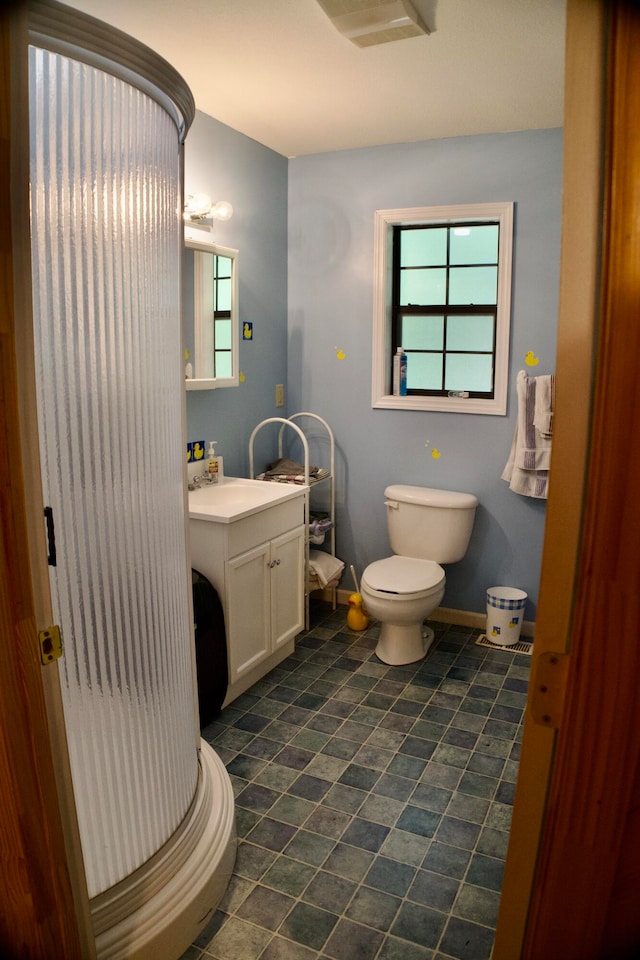 bathroom featuring toilet and vanity