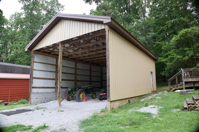 view of outbuilding with a yard