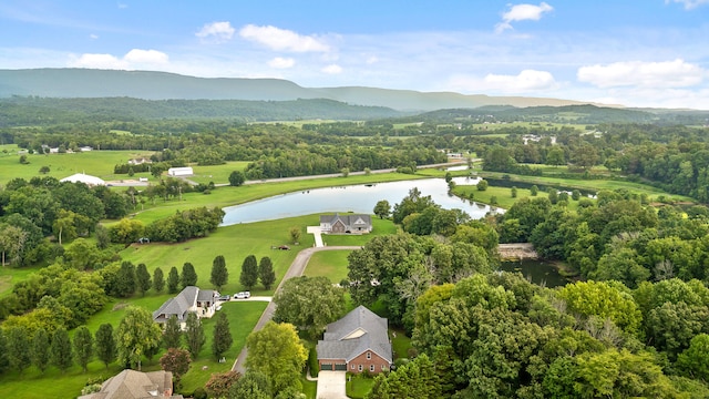 drone / aerial view featuring a water and mountain view