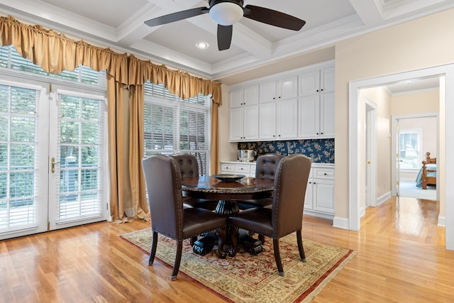 dining area featuring light wood-type flooring, a healthy amount of sunlight, and ceiling fan