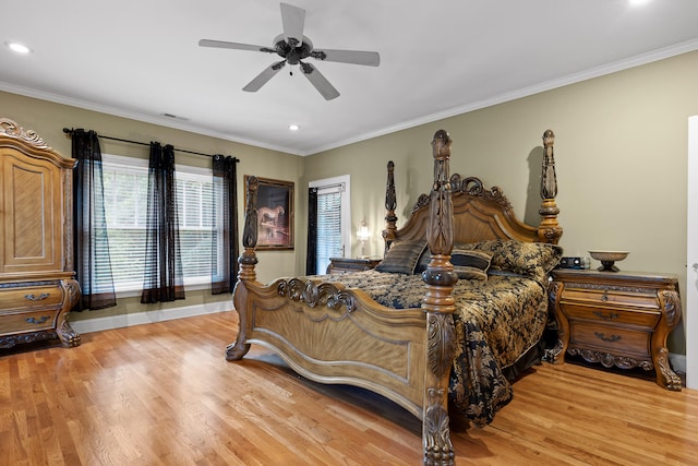 bedroom with light hardwood / wood-style flooring, ceiling fan, and ornamental molding